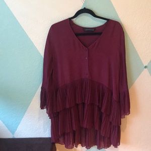 burgundy tunic.